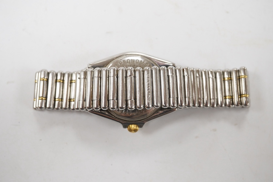 A lady's recent stainless steel and gold Breitling Callistino quartz wrist watch, with Arabic dial and date aperture, case diameter 26mm, on a Breitling bracelet, no box or papers. Condition - not currently running other